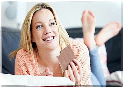 Woman eating chocolate