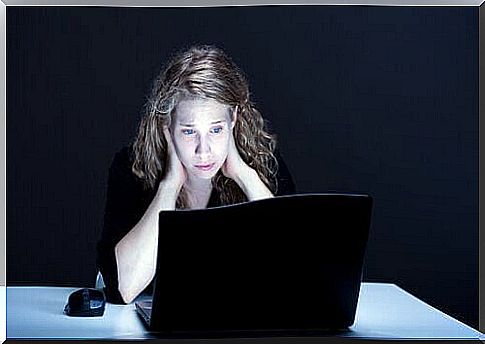 Woman looking sad in front of the computer - no friends