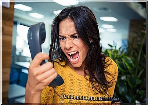 Young woman shouting on the phone