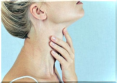 Woman touching her neck