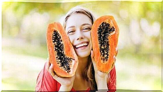 Girl smiling with papaya