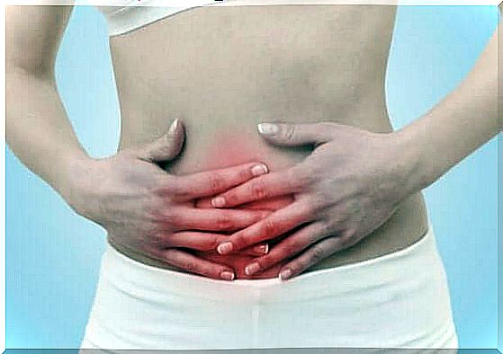 Woman holding on to stomach in pain