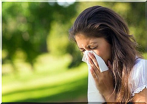 Woman brushing nose