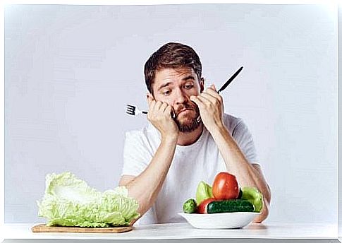 Man sitting sad with a salad