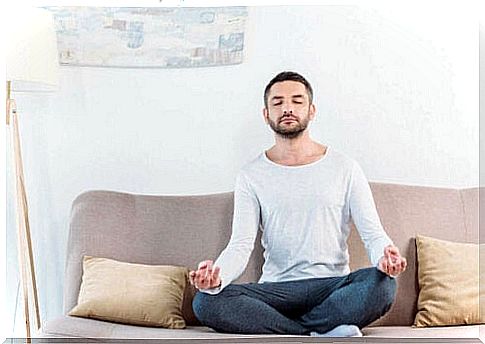 Man in sofa is example of meditating successfully