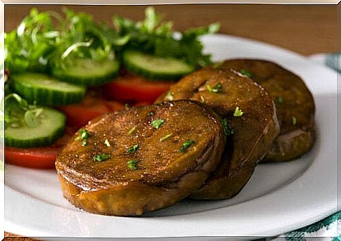 A plate of seitan steaks and vegetables