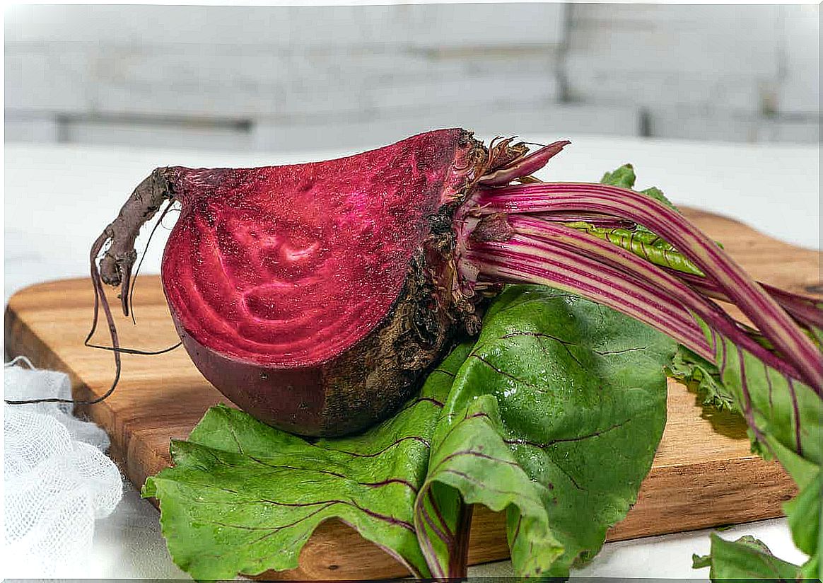 A beetroot in leaves