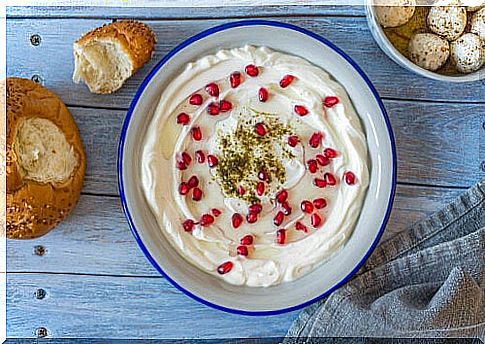 Labneh with pomegranate in bowl