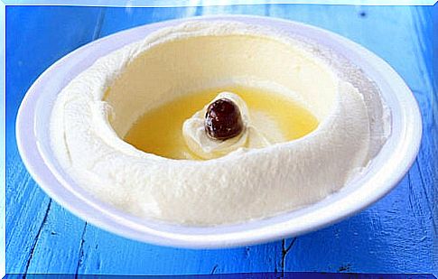 Yogurt cheese in bowl with olives