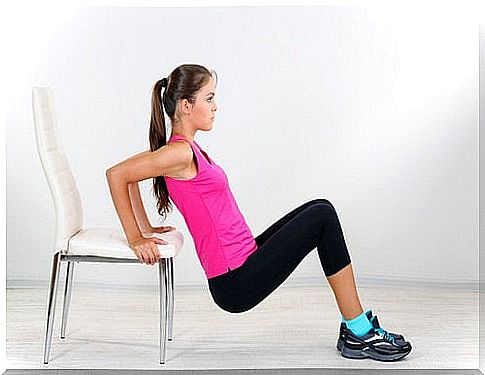 Woman exercising with a chair