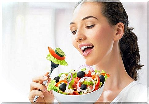 Woman eating salad - time to exercise