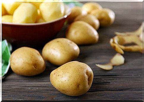 Peeled and unpeeled potatoes for a beef stew recipe