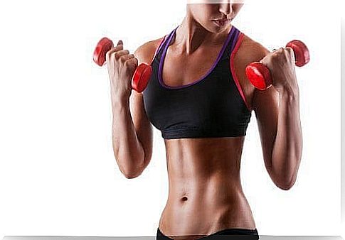 Woman uses two dumbbells