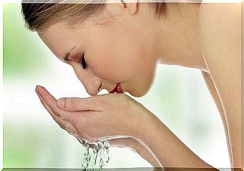 Woman washes face