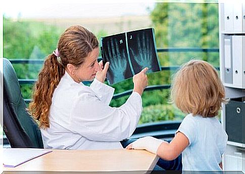 doctor studying the bone development of a child