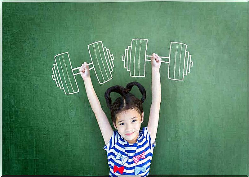 A child pretending to lift weights