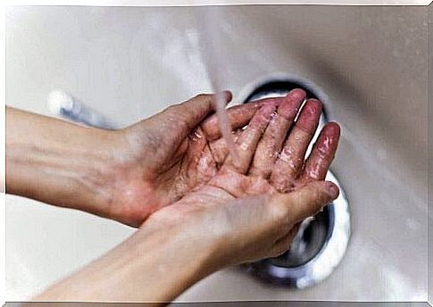 Person washes hands