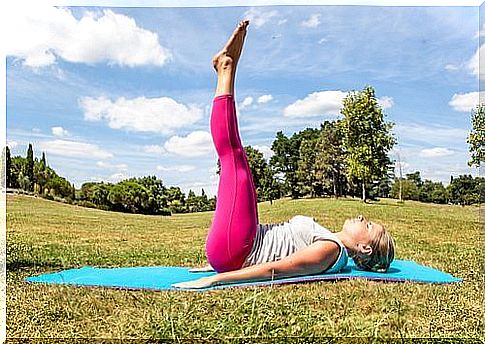 Woman lying with her legs up