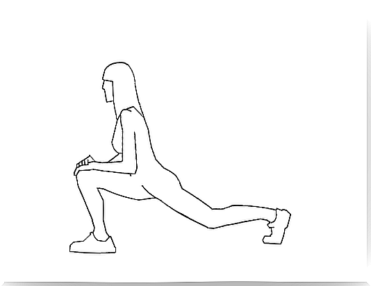 A woman stretches her leg out