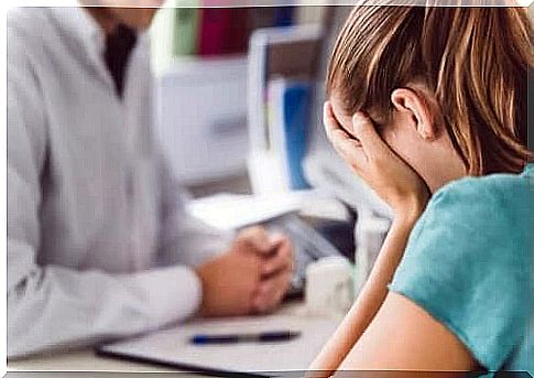 Depressed woman by doctor