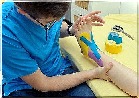 A physiotherapist using Kinesio Tape