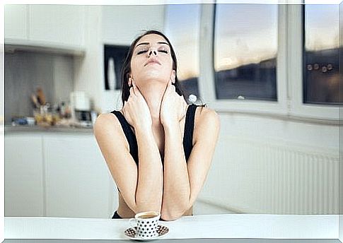 Woman sitting with a cup of coffee