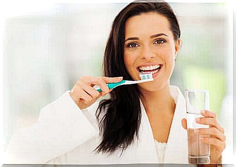 Woman brushes teeth