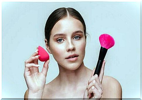 Woman with tools to apply makeup