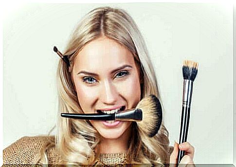 Woman with makeup brushes