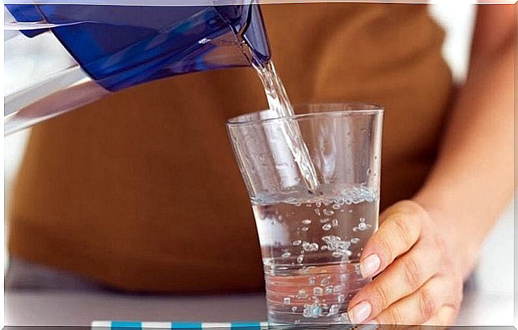 Woman pouring a glass of water