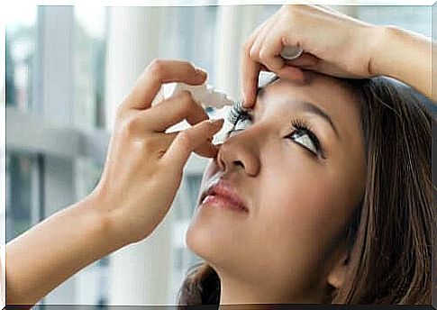 Woman using eye drops with brimonidine