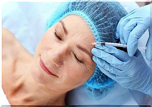 Woman gets injection as part of facial treatment